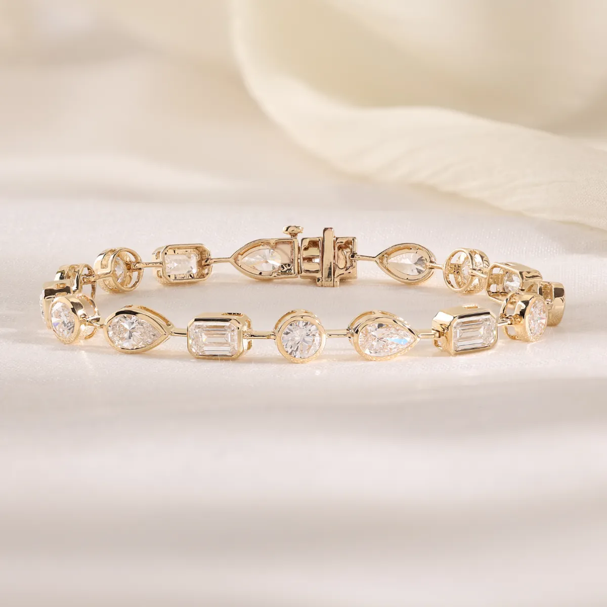 Bezel Setting Emerald, Pear & Round Diamond Tennis Bracelet 